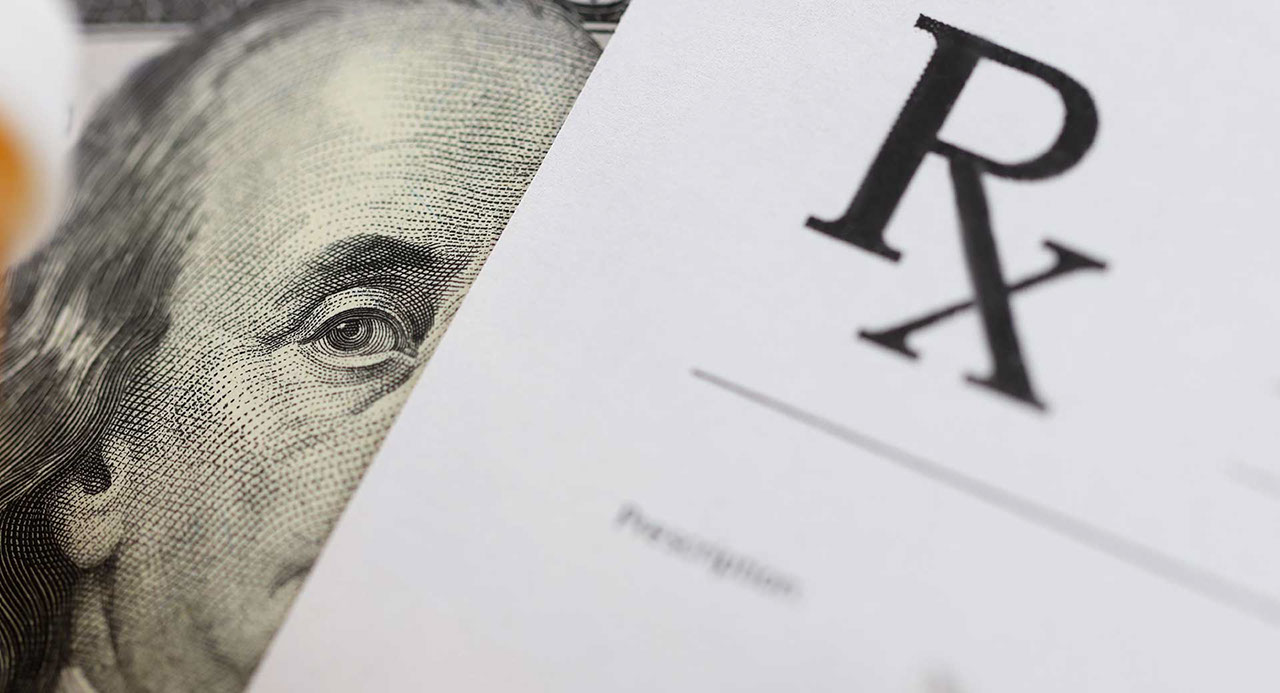 Dollar bill and doctors prescription are on doctors table in clinic closeup. Corruption among doctors concept